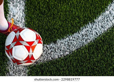 Soccer player starting a corner kick of ball - Powered by Shutterstock