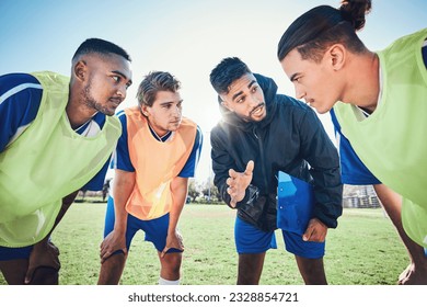 Soccer player, team talk and coach on field for tactics, sport and listen together for training, advice or fitness. Athlete men, group and mentor on pitch for exercise, football or teamwork in summer - Powered by Shutterstock