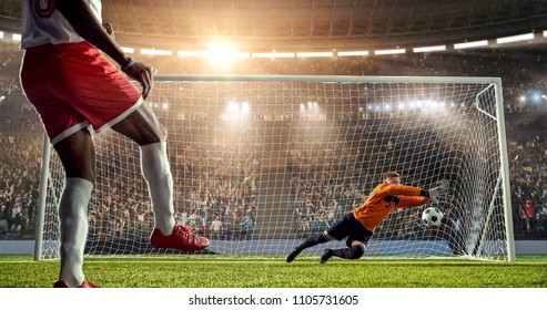 Soccer Player Is Trying To Score A Goal While Goalkeeper Defends On A Professional Soccer Stadium. Stadium And Crowd Are Made In 3D.