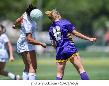 Soccer Player Using Head To Hit The Ball