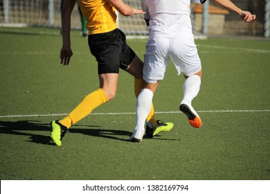 Soccer players in action, close-up - Powered by Shutterstock