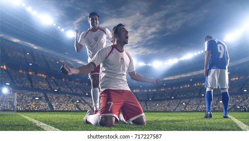 Soccer Players Celebrate A Victory During A Soccer Game On A Professional Outdoor Soccer Stadium. They Wear Unbranded Soccer Uniform. Stadium And Crowd Are Made In 3D.