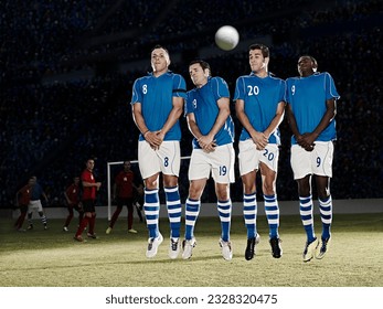 Soccer players jumping on field - Powered by Shutterstock