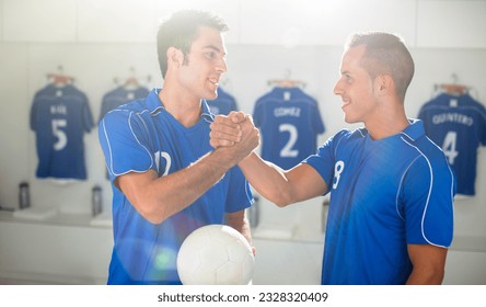 Soccer players shaking hands in locker room - Powered by Shutterstock