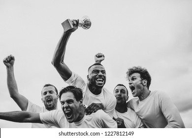 Soccer players team celebrating their victory