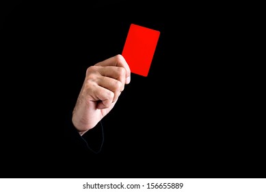 Soccer Referee Giving Red Card On Black Background.