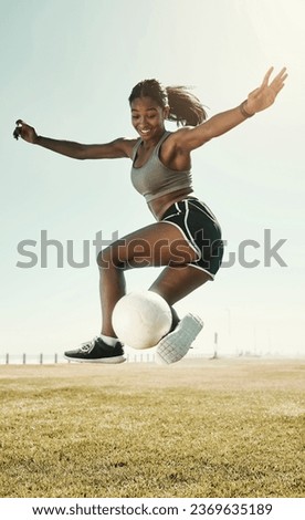 Soccer, skill and athlete jumping with a ball during an outdoor match on a sports field in South Africa. Football, trick and healthy woman practicing fitness and exercise at sport training or game.