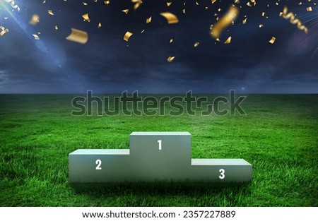 soccer sport podium on grass inside the stadium - Podium for 1st, 2nd, and 3rd Places of 3 Winners - Awards stand stage on Grassy Field - Evening sky over green grass field with celebration papers
	