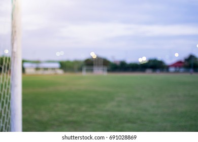 Soccer Stadium In Blurry For Background , Blurry Focus Football Field In The Stadium For Background