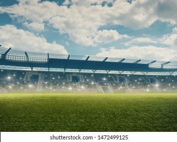 Soccer Stadium With Tribunes And Spectators. Green Grass And Cloudy Blue Sky