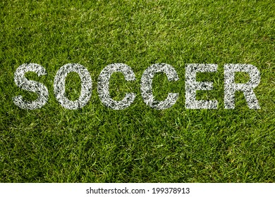 Soccer Text On A Green Meadow