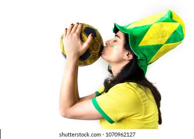 Soccer Woman Celebrating On Yellow Uniform With Big Hat And Ball Isolated On White Background. Beautiful Woman Happy And Cheering.
