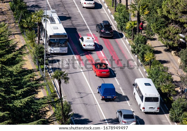 Sochi, Russia - 01.05.2019 Cars are on the road.\
The central street of the city. View from above. Traffic flow.\
Traffic. Two-way\
traffic.