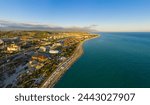 Sochi, Russia. City beach - Olympic beach. Settlement Sirius Territory. Aerial view. Sunset time