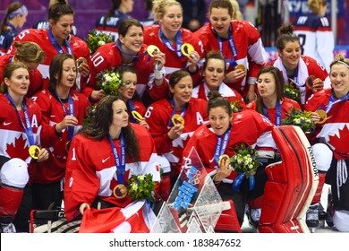 Sochi, RUSSIA - February 20, 2014: Canadian Women's Ice hockey team gold medalists, at medal ceremony after Gold Medal Game vs. USA team at the Sochi 2014 Olympic Games