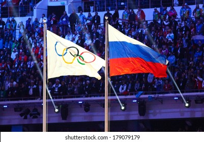 Sochi, RUSSIA - February 23, 2014: Olympic And Russian Flag At Closing Ceremony In Fisht Olympic Stadium At The Sochi 2014 Olympic Games