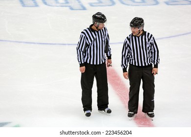 SOCHI, RUSSIA - MAR 12, 2014: Paralympic Winter Games. Shayba Arena, Ice Sledge Hockey Italy-Sweden. Hockey Referees Discuss The Game