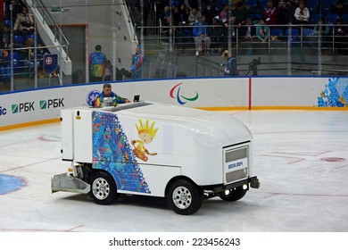 SOCHI, RUSSIA - MAR 12, 2014: Paralympic Winter Games. Shayba Arena, Ice Sledge Hockey Italy-Sweden. Resurfacer Prepares The Ice