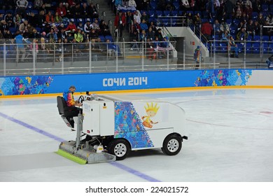 SOCHI, RUSSIA - MAR 12, 2014: Paralympic Winter Games. Shayba Arena, Ice Sledge Hockey Italy-Sweden. Resurfacer Prepares The Ice