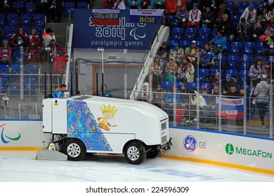 SOCHI, RUSSIA - MAR 12, 2014: Paralympic Winter Games. Shayba Arena, Ice Sledge Hockey Italy-Sweden. Resurfacer Prepares The Ice