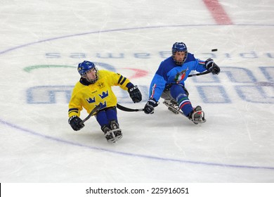 SOCHI, RUSSIA - MAR 12, 2014: Paralympic Winter Games In Ice Arena Shayba. The Sledge Hockey, Match Italy-Sweden