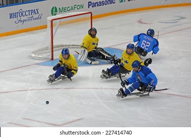 SOCHI, RUSSIA - MAR 12, 2014: Paralympic Winter Games In Ice Arena Shayba. The Sledge Hockey, Match Italy-Sweden. The Teams In Hockey Gate