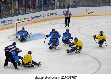 SOCHI, RUSSIA - MAR 12, 2014: Paralympic Winter Games In Ice Arena Shayba. The Sledge Hockey, Match Italy-Sweden. The Teams In Hockey Gate