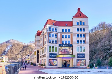 Sochi, Russia - March 4, 2020: The Street Of Ski Resort Rosa Khutor. The Building Of The Casino. Spring Landscape