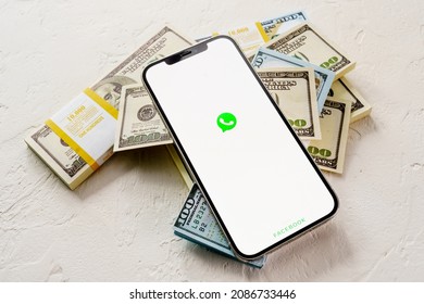 Sochi, Russia - October 1, 2021: Apple IPhone 12 Pro  With Messenger WhatsApp On The Screen And Dollar Money