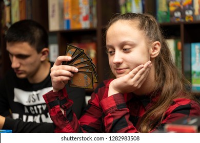 SOCHI, RUSSIA-JANUARY 12, 2019: A Girl Is Playing In Board Game Magic: The Gathering