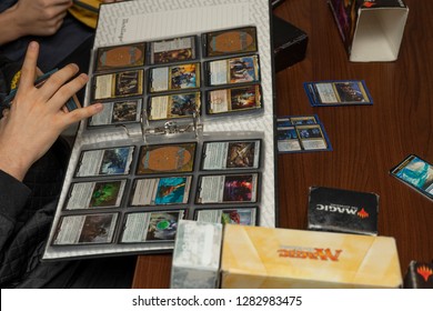 SOCHI, RUSSIA-JANUARY 12, 2019: The guy chooses the cards for the board game Magic: The Gathering