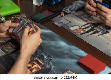 SOCHI, RUSSIA-MAY 17, 2019: People are playing in the board game War of the Spark Magic: The Gathering. New expansion