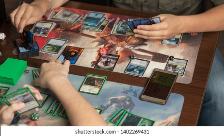 SOCHI, RUSSIA-MAY 17, 2019: Two man are playing in board game Magic The Gathering. Board game concept
