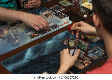 SOCHI, RUSSIA-MAY 17, 2019: Two guys are playing on new expansion game The War of the Spark Magic The Gathering