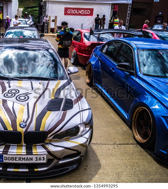 Sochi. Summer\
2018. Festivals Grounded Event. BMW car with polished wheels,\
aerodynamic bodywork and air suspension installed in the parking\
lot to participate in the\
festival