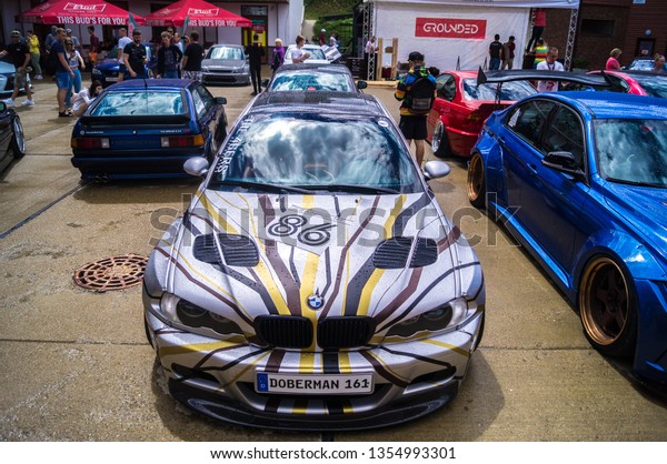 Sochi. Summer\
2018. Festivals Grounded Event. BMW car with polished wheels,\
aerodynamic bodywork and air suspension installed in the parking\
lot to participate in the\
festival