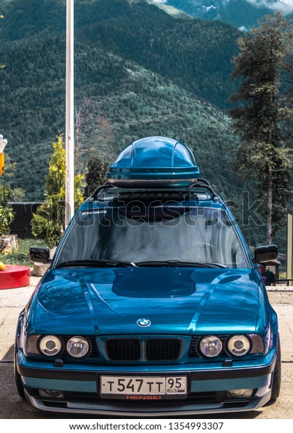 Sochi. Summer\
2018. Festivals Grounded Event. BMW car with polished wheels,\
aerodynamic bodywork and air suspension installed in the parking\
lot to participate in the\
festival.