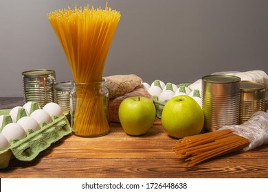 Social assistance from the state. The products of the first necessity. Non-perishable foods, spaghetti, canned food, apples, eggs, cereals, sugar. - Shutterstock ID 1726448638