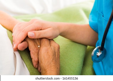 Social Care Provider Holding Senior Hands In Caring Attitude - Helping Elderly People.