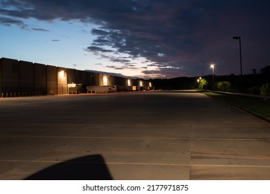 Social Circle Georgia USA July 13 2022 A Long Exposure With Tail Lights In Front Of A Warehouse