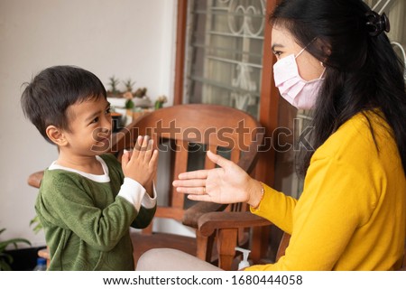 Social distance. Asian boys refuse to shake hands when the virus spreads