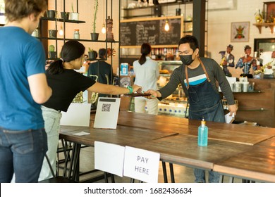 Social Distance Conceptual Small Business Waiter Serving Customer In Cafe.