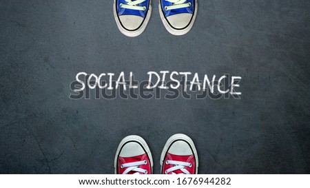 Social distance. two people keep spaced between each other for social distancing, increasing the physical space between people to avoid spreading illness during transmission of COVID-19 outbreak