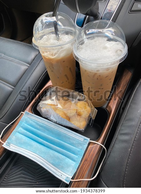 Social distancing, Iced coffee and bakery\
takeaway during covid-19\
pandemic.