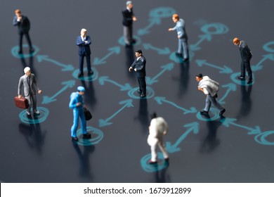 Social distancing, keep distance in public society people to protect COVID-19 coronavirus outbreak spreading concept, businessmen miniature keep distance away in the meeting with distant measure.