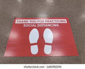 Social Distancing Sign At A Grocery Store Near Canned Food During The Covid-19 Coronavirus Pandemic