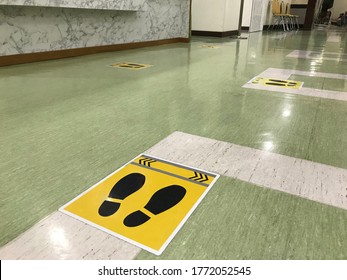 The Social Distancing Sign Stickers Are On The Floor Of The School Community To Prevent The Covid19 Virus Infection