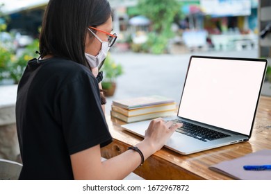 Social Distancing Student Concept, Education At Home. Junior High School Girl Do Homework At Home With Laptop. Teen Study Home The School Is Closed During Coronavirus Covid-19. 