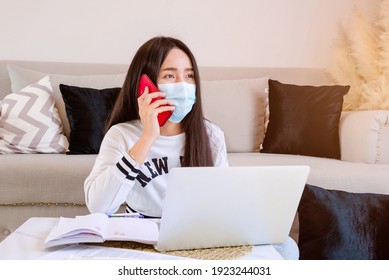 Social Distancing Student Concept, Junior High School Girl And Boy Do Homework At Home With Laptop. Education At Home. The School Is Closed During Covid-19 Asia Thailand