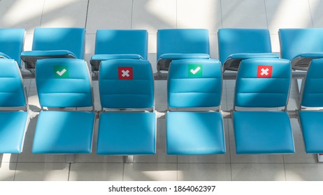 Social Distancing For Travel Safety With Seat Allocation And Sitting Distance Allowance Warning Sign On Empty Chairs In Airport Or Bus Terminal During Covid-19, Coronavirus Pandemic With No People